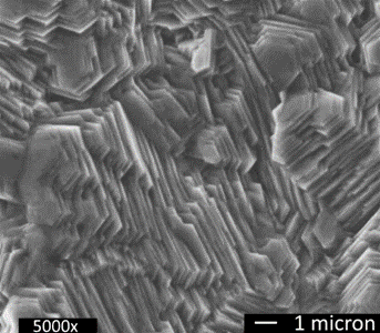 Figure 2: High magnification photograph of electrogalvanized steel surface showing stacked plate-like structure.